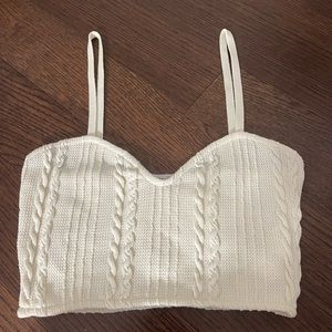 Selling a brand new Zara cropped tank top. It is a cream color and size M.